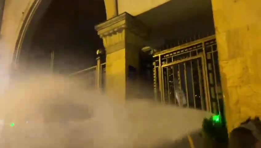 Protesters against Georgia’s foreign agent law have tried to barricade an entrance to the Georgian Parliament, as police inside the courtyard deploy water cannons to push the crowds away from the gate