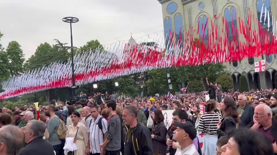 People chant “Russians”, “Slaves” outside of the Georgian parliament as the ruling Georgian Dream adopts the law on foreign agents