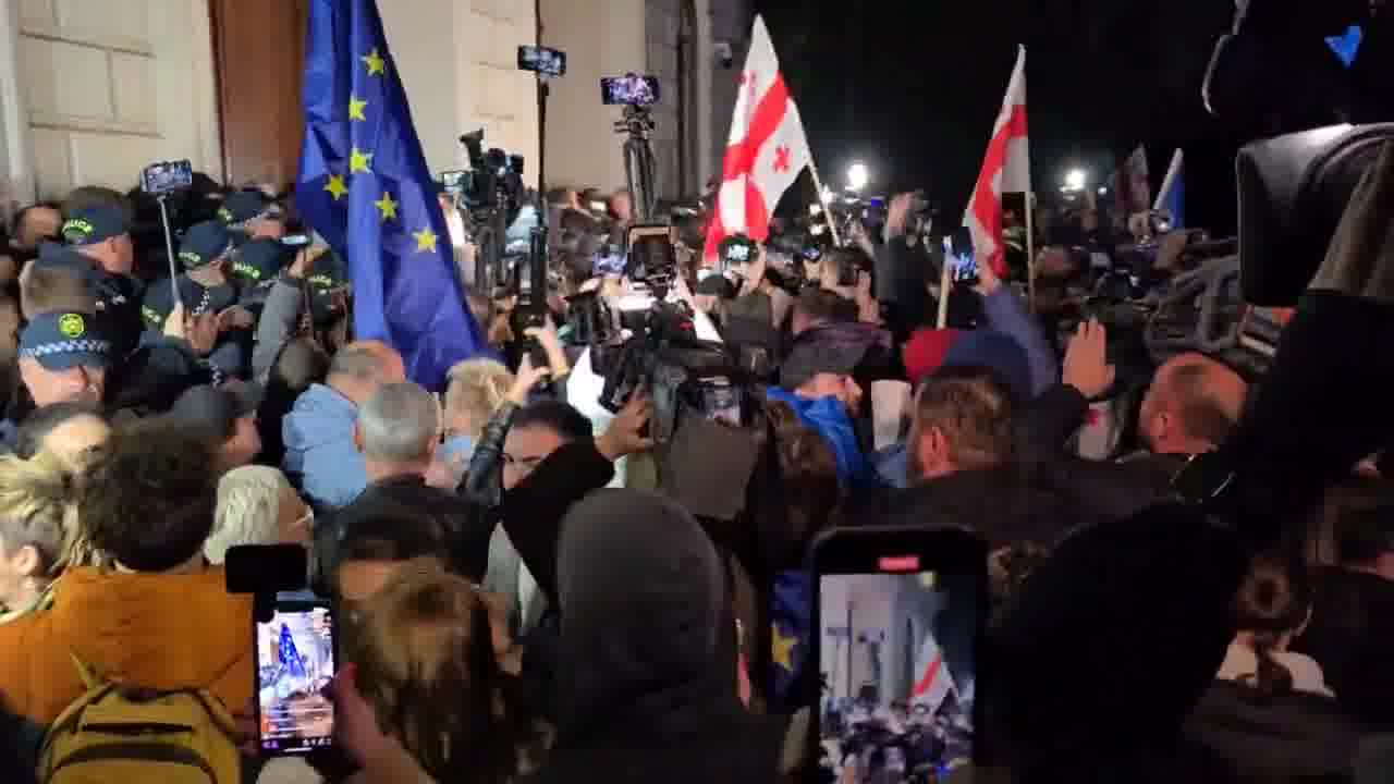 Protesters in Tbilisi have joined a group of students attempting to enter Tbilisi State University to conduct a sit-in against the falsification of October’s parliamentary elections. The situation remains tense as protesters and police confront each other