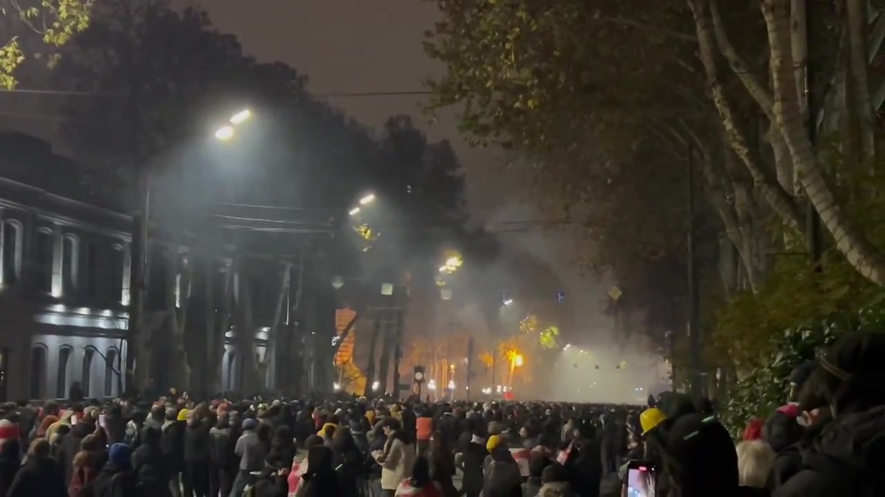 It’s midnight in Tbilisi. Riot police are stationed near the Marriott hotel, protesters are stretching across Rustaveli avenue. Tear gas is being deployed nonstop and is sensed throughout the entire area