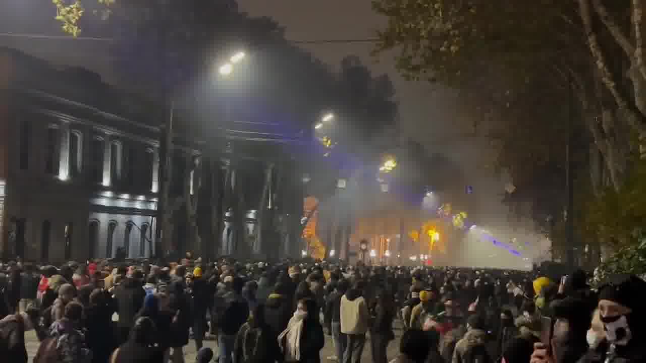 It’s midnight in Tbilisi. Riot police are stationed near the Marriott hotel, protesters are stretching across Rustaveli avenue. Tear gas is being deployed nonstop and is sensed throughout the entire area