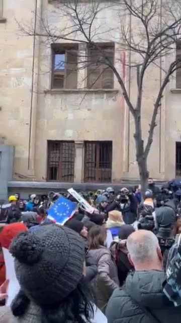 Let go - it's my kid. - Mothers' March participants chant as they arrive at Parliament. Line inspired by violent arrests of young protesters in November-December, sometimes in presence of their mothers. March to continue to Orbeliani Presidential Palace.