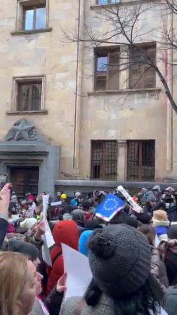 Let go - it's my kid. - Mothers' March participants chant as they arrive at Parliament. Line inspired by violent arrests of young protesters in November-December, sometimes in presence of their mothers. March to continue to Orbeliani Presidential Palace.