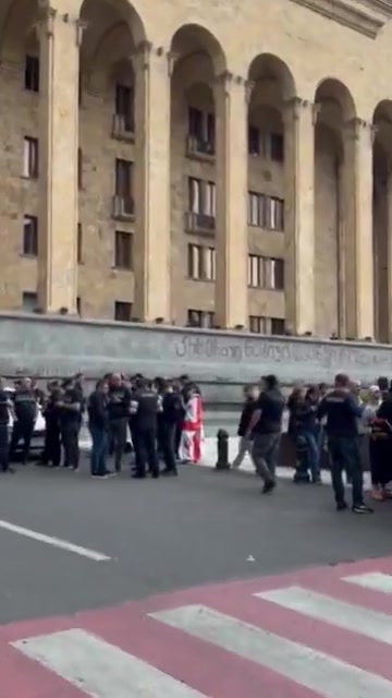 Rustaveli Avenue now, near the parliament building, where police arrested several demonstrators in a rally that was blocking the street. The unusual daytime gathering followed the earlier arrest of two other protesters last night on Easter